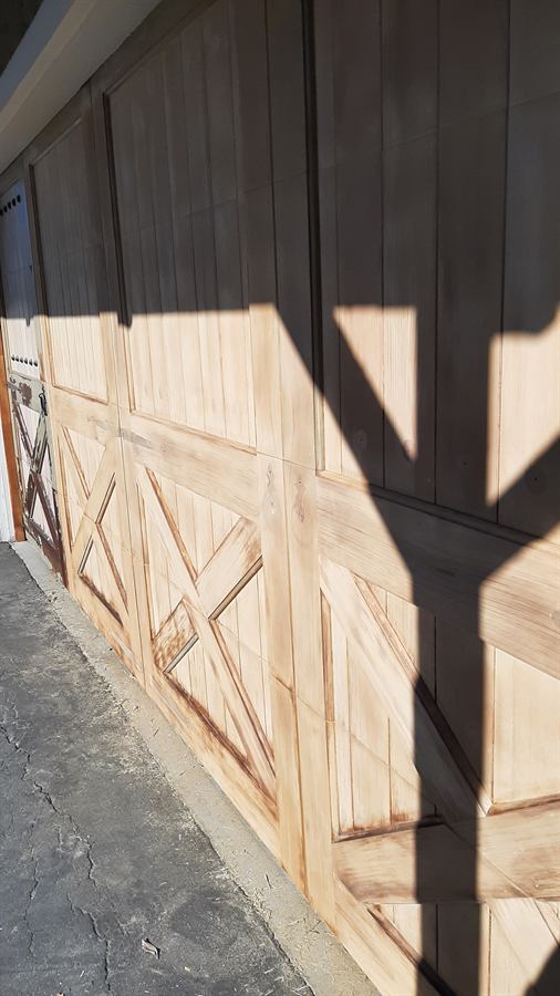 Garage doors sanded back to bare wood, ready for stain